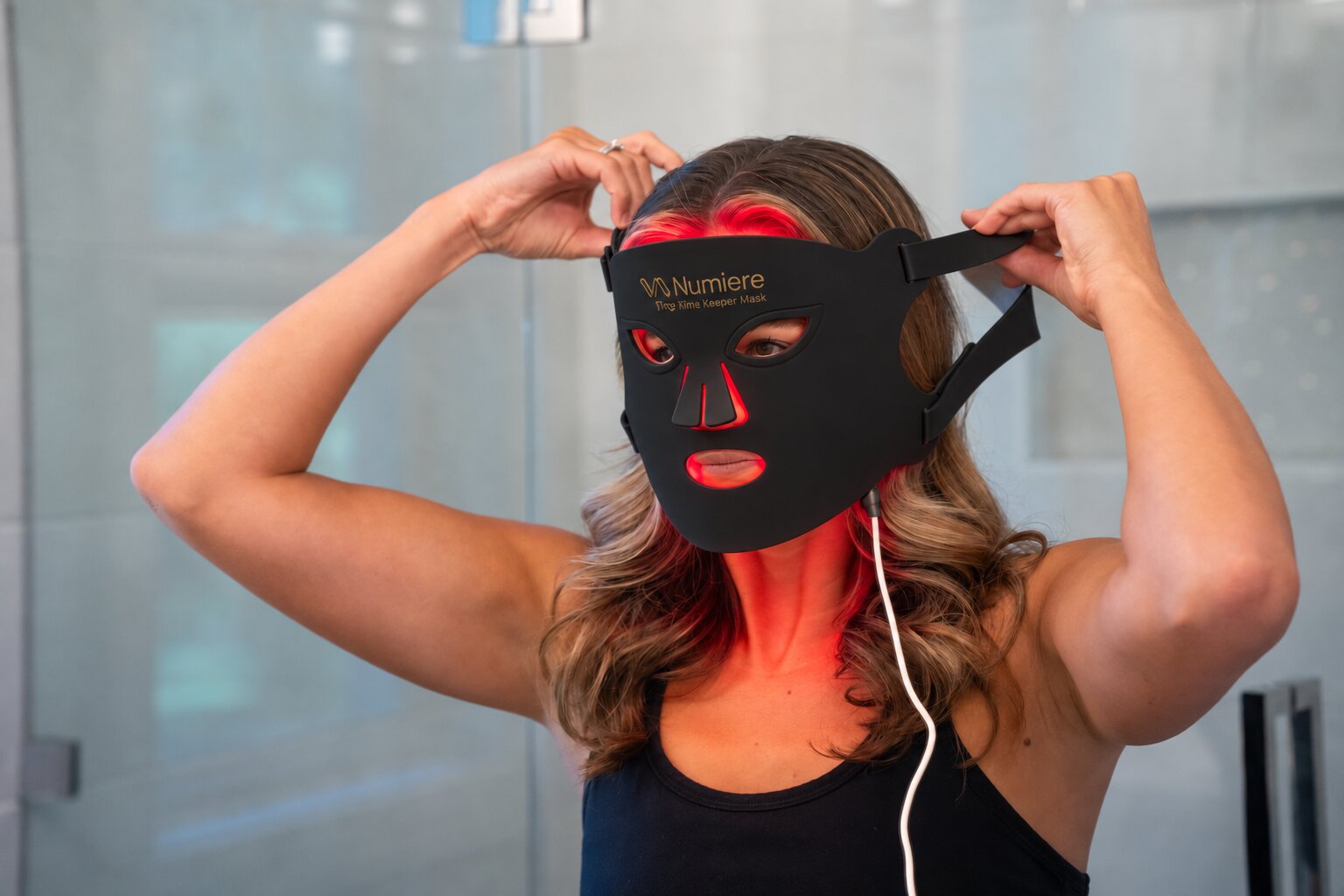 Black Time Keeper mask being fitted for a red-light session